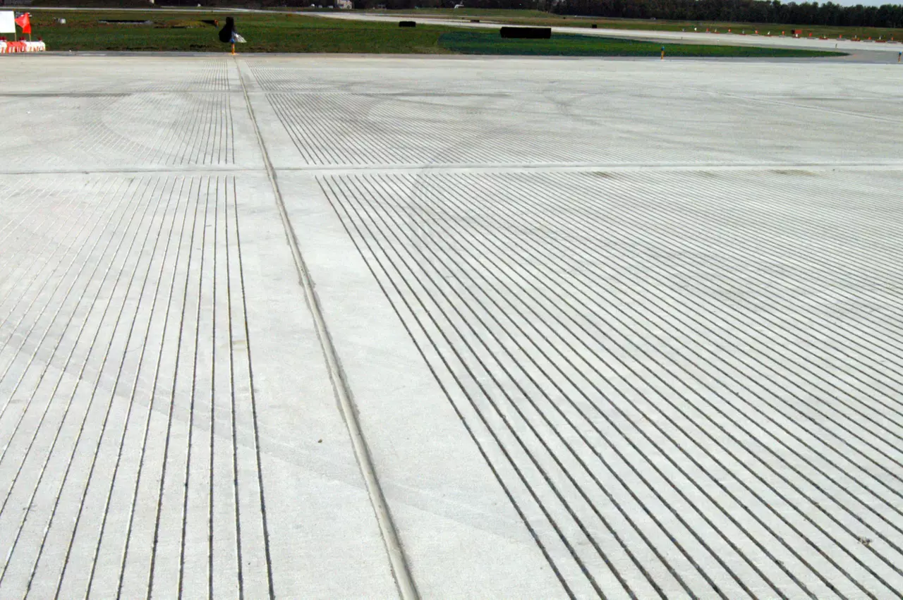 Over 300,000 linear feet of joint widening and sealing utilizing Dow Corning 888 and 890 silicone sealant. Primary runway at Andrew Air Force Base, home of Air Force One. Fast track project to minimize disruption of base operations (Andrews only has two active runways). DC 888 and 890 was used in concrete and concrete to asphalt joints. DC888 and 890 were used in concrete to concrete transverse and longitudinal runway and shoulder joints. 888 used in construction, expansion, and contraction joints and 890 used in concrete to asphalt interface joints