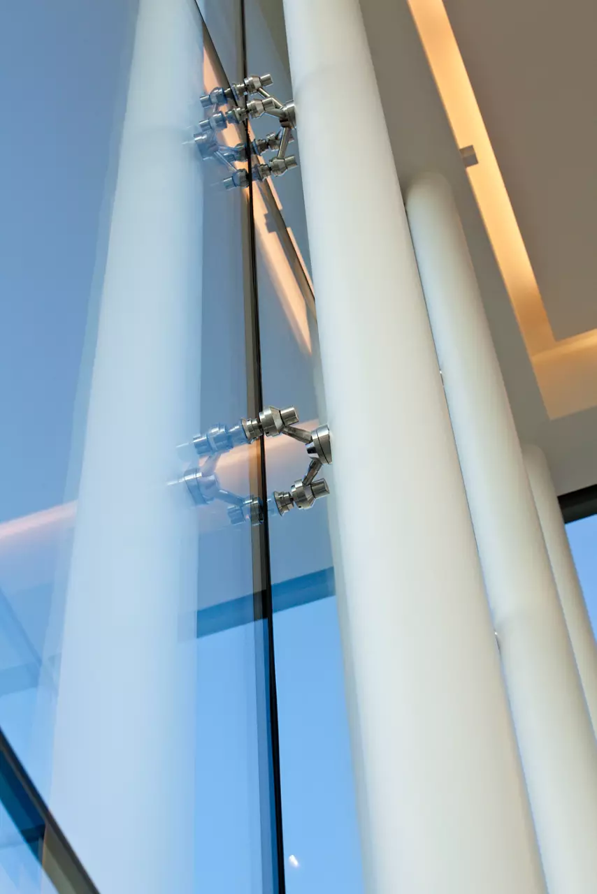 Supporting polls outside tall structure