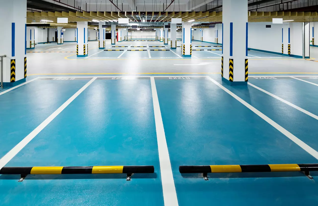 Empty underground parking lot in modern building.