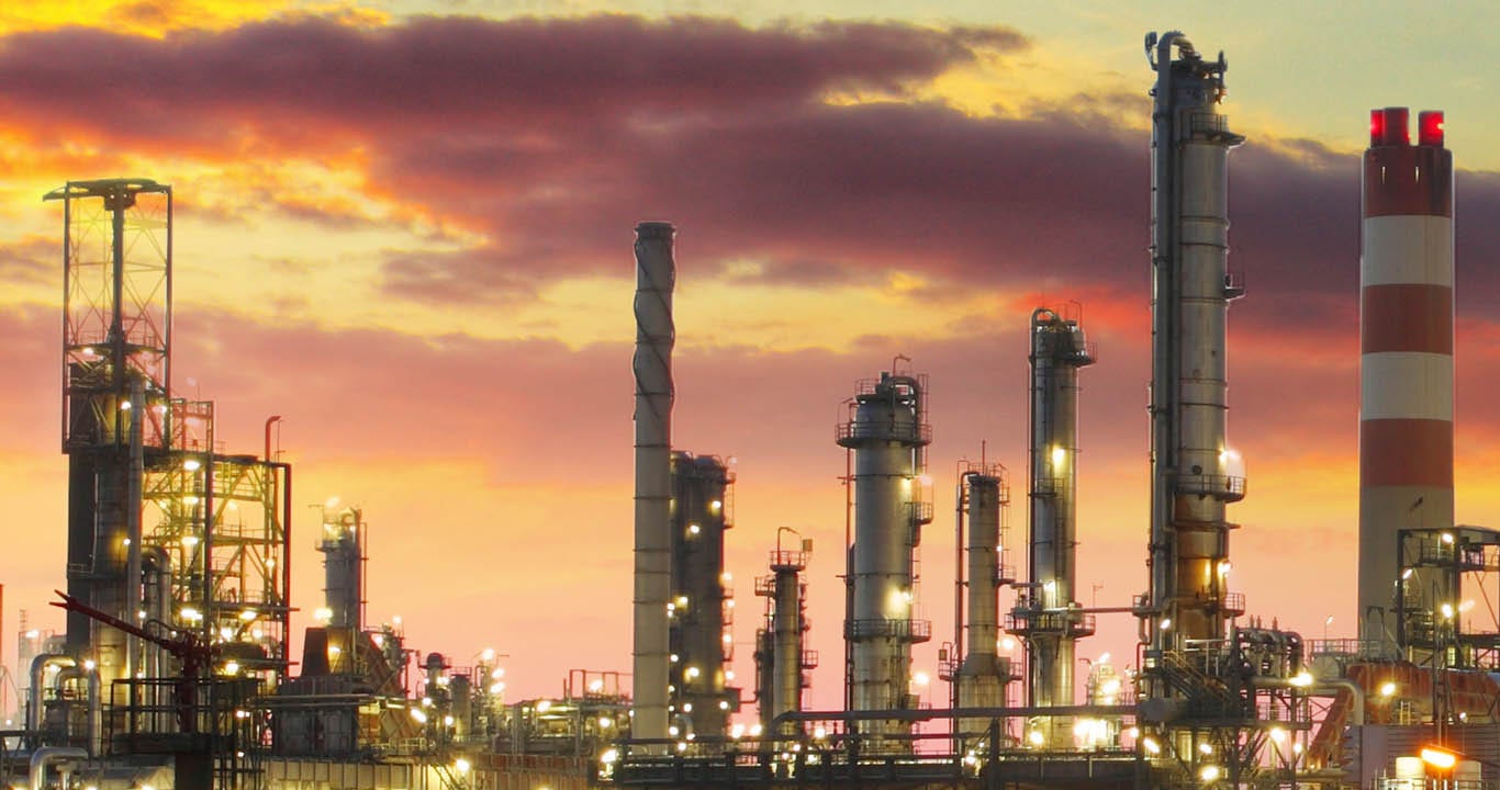 Oil refinery at sunset