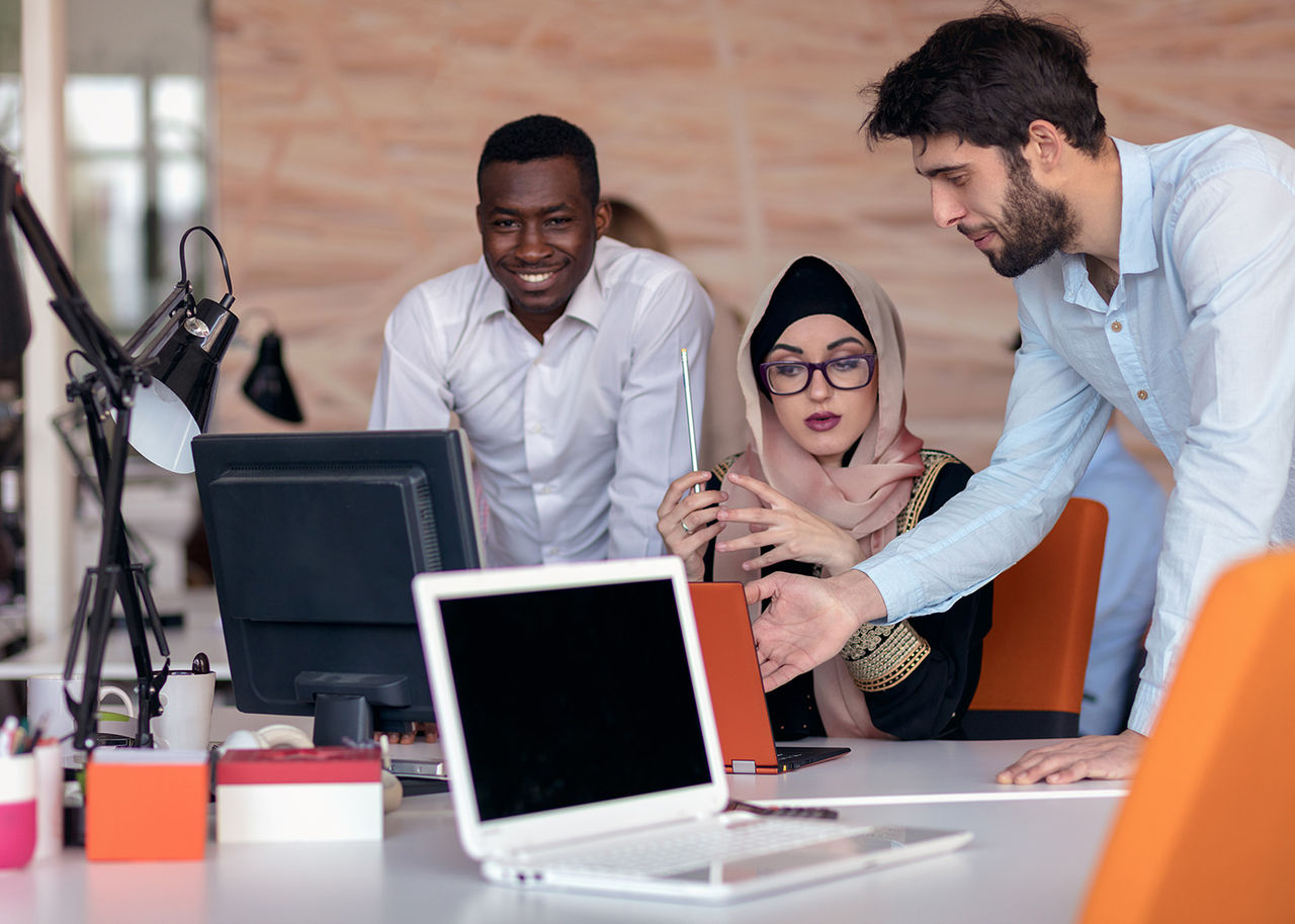  three colleagues meet about packaging materials