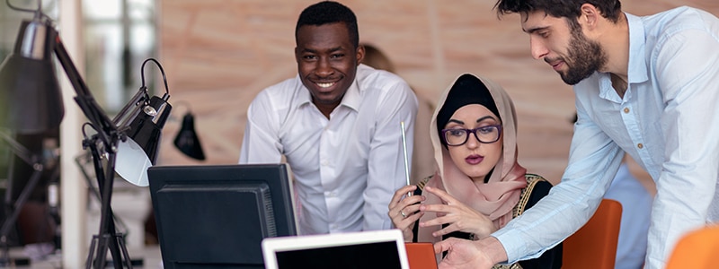 three diverse colleagues working together