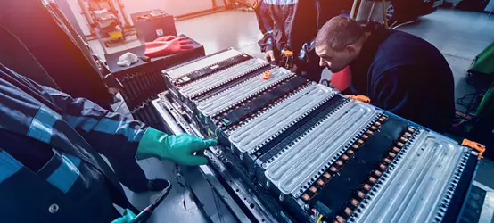 Charging the batteries of the elecric motor. Disassembling the battery of an electric vehicle engine. Car service