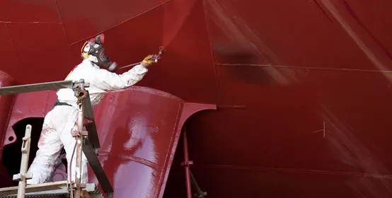 worker painting ship hull using airbrush red paint; Shutterstock ID 48203134; PO: redownload; Job: redownload; Client: redownload; Other: redownload
